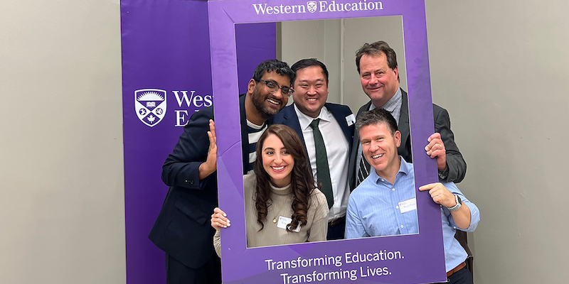 five alumni members inside a western education photo frame